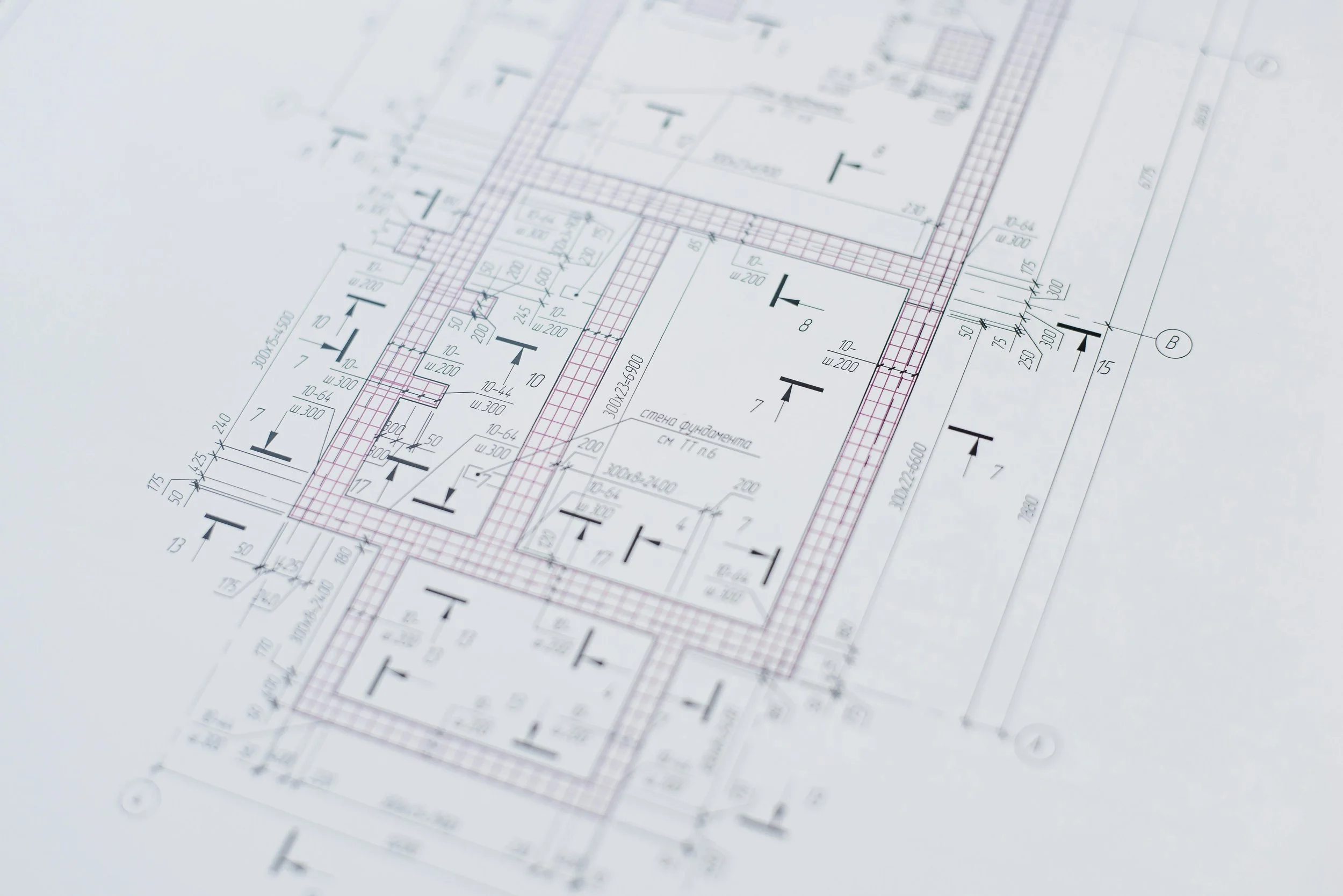 Architectural blueprint with detailed building design, measurements, and notes.