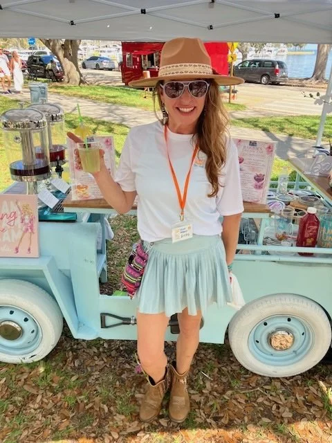 girl in hat and skirt by wagon.jpg