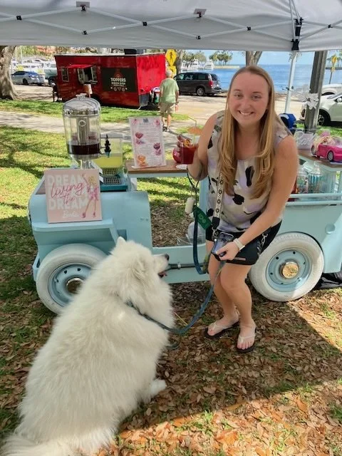 girl with white dog by wagon.jpg
