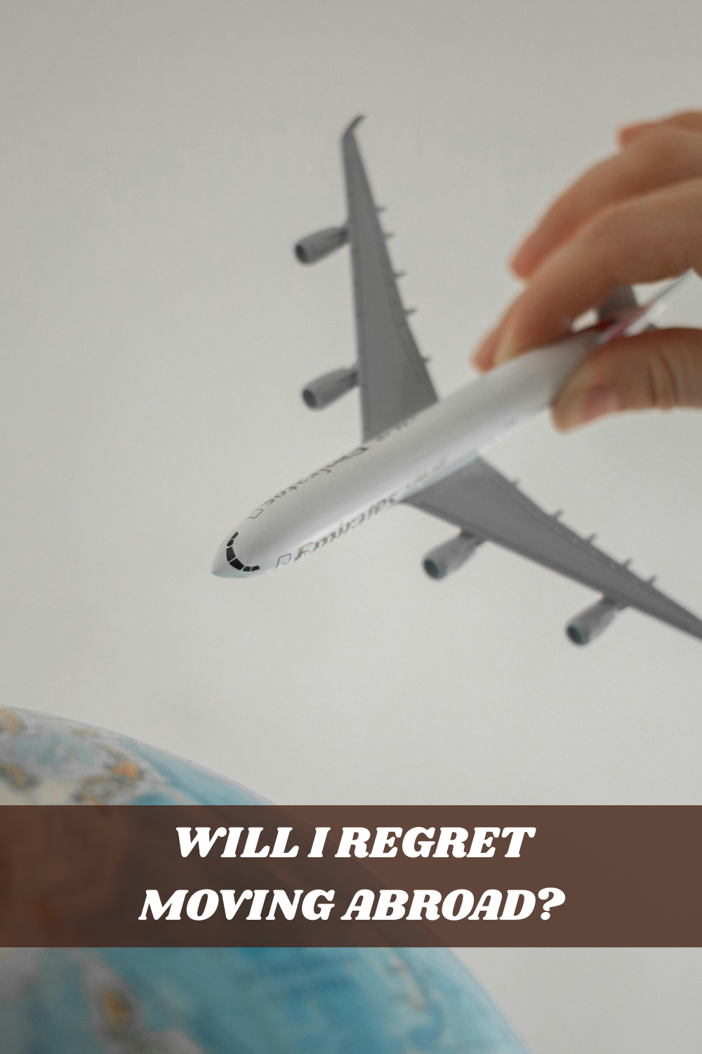 will i regret moving abroad concept with airplane over globe representing international travel and life abroad decisions