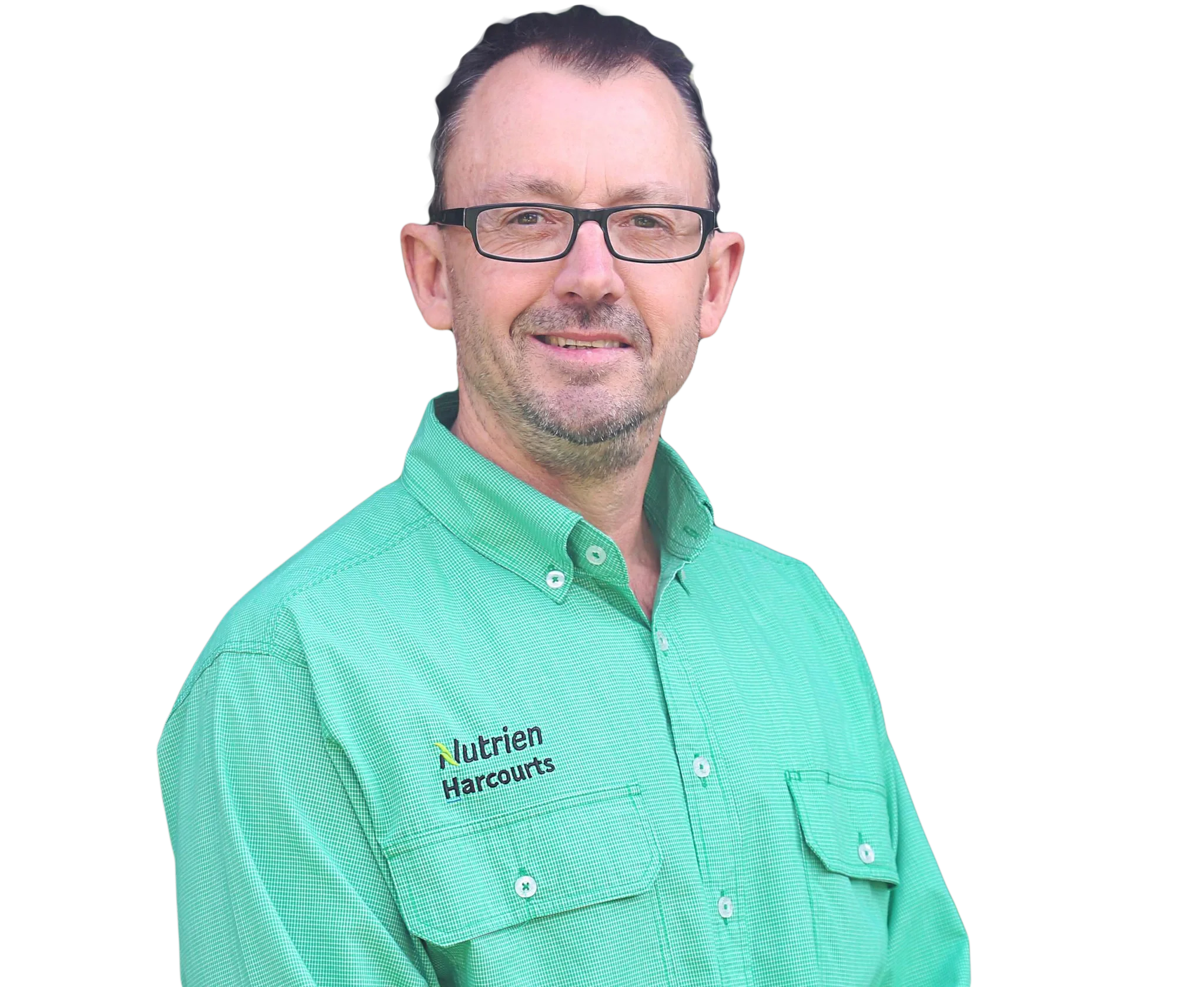 A middle-aged man with short dark hair, glasses, and a slight beard wearing a green collared shirt with visible logo and text. The background is removed for a clean look.