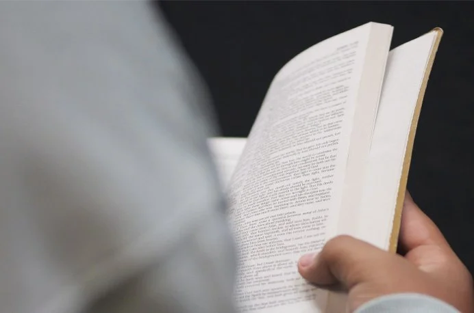Person reading a book.