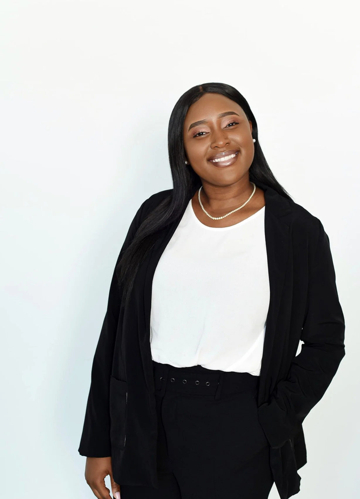 Davina Mukinav therapist at Next Chapter Counselling, standing in professional attire representing a grounded and supportive counselling presence.
