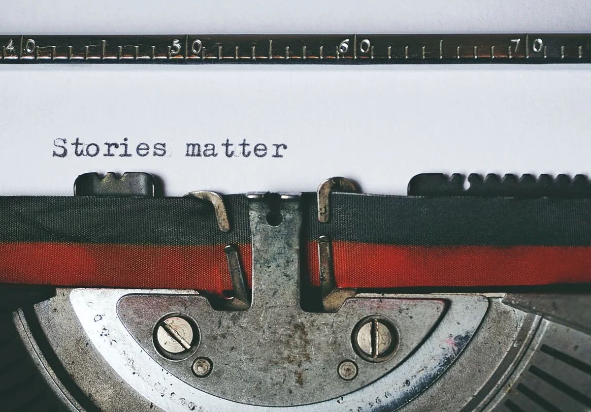 a-typewriter-with-the-words-tell-your-story-typed-out-wellness.jpg