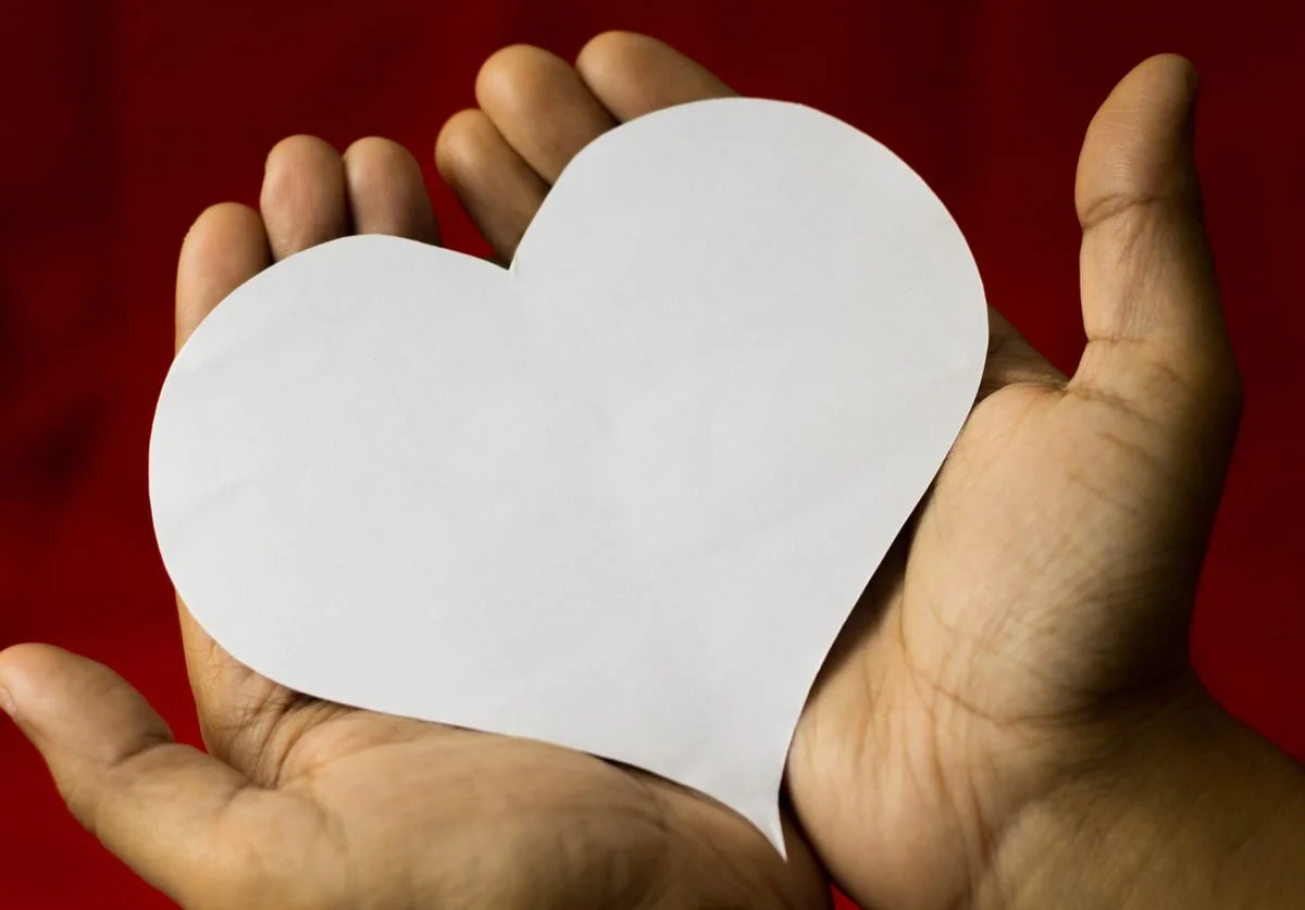 holding-a-paper-heart-in-hands-nomadic-virtual-solutions-wellness.jpg