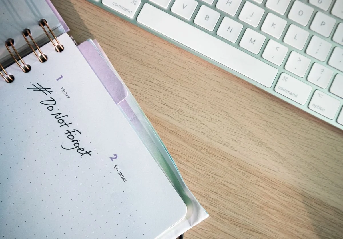 a-notebook-with-the-words-do-not-forget-spelled-out-nomadic-virtual-solutions.jpg