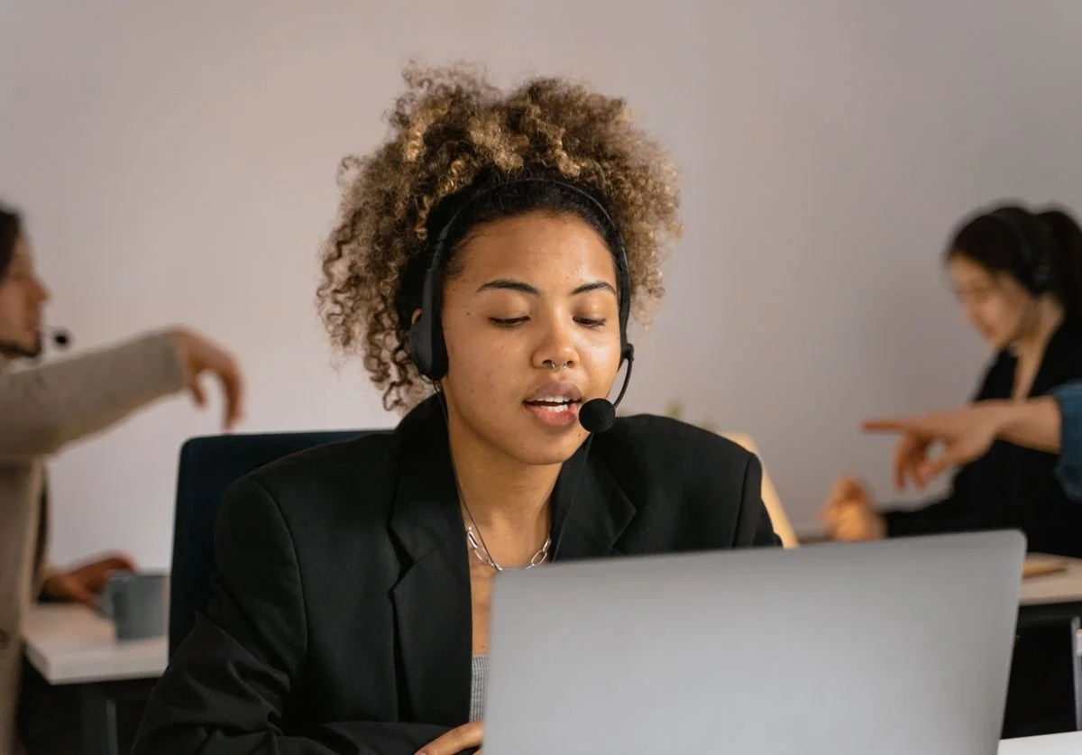 woman-talking-on-headset-laptop-providing-digital-service.jpg