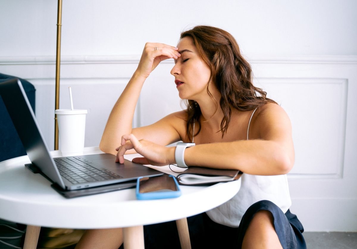 woman-on-laptop-with-an-exhausted-expression-on-her-face.jpg
