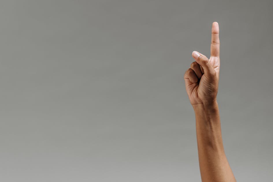 woman-raising-her-finger-to-ask-a-wellness-website-design-question.jpg