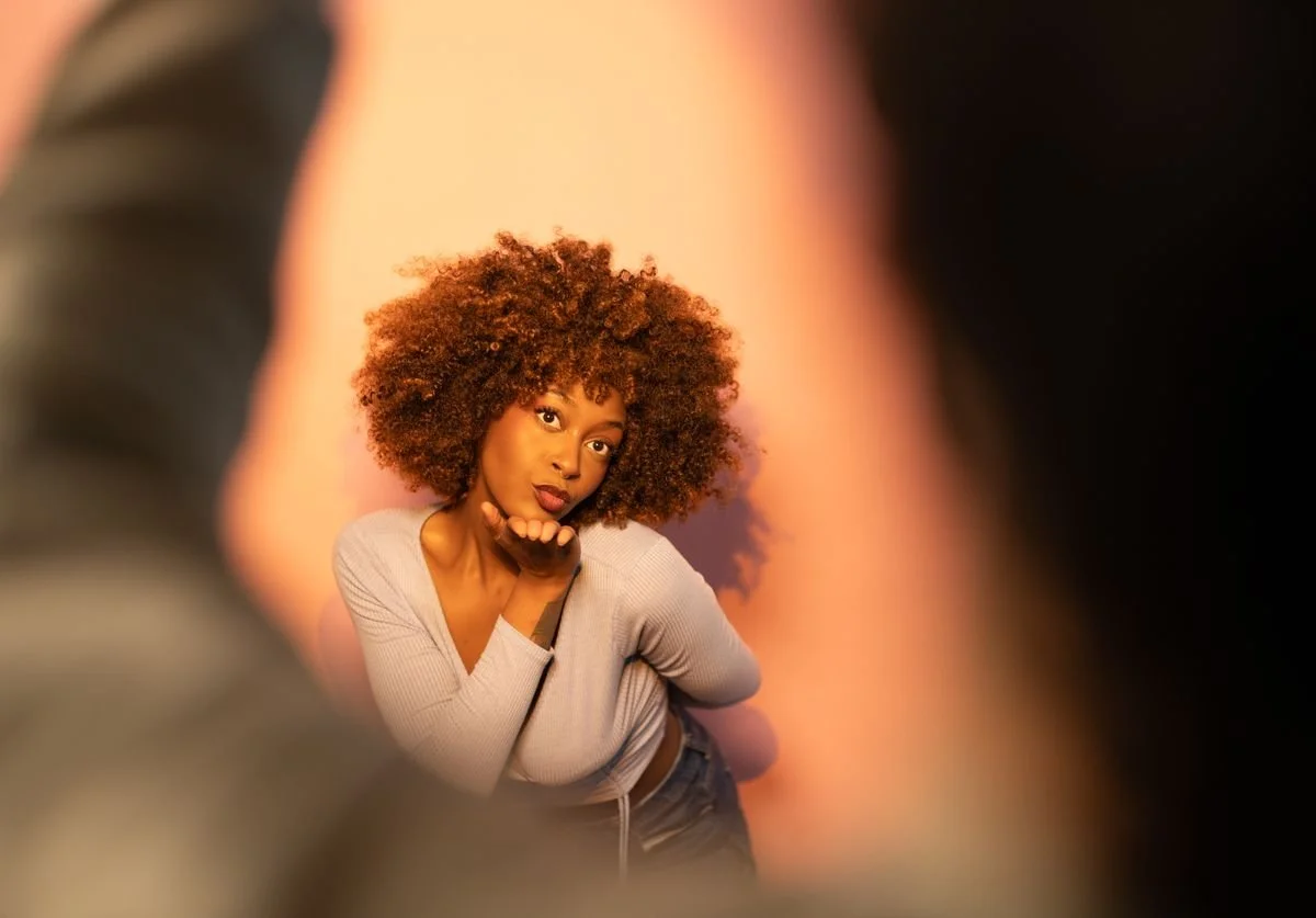 a-woman-posing-through-hands-framing-her-wellness.jpg