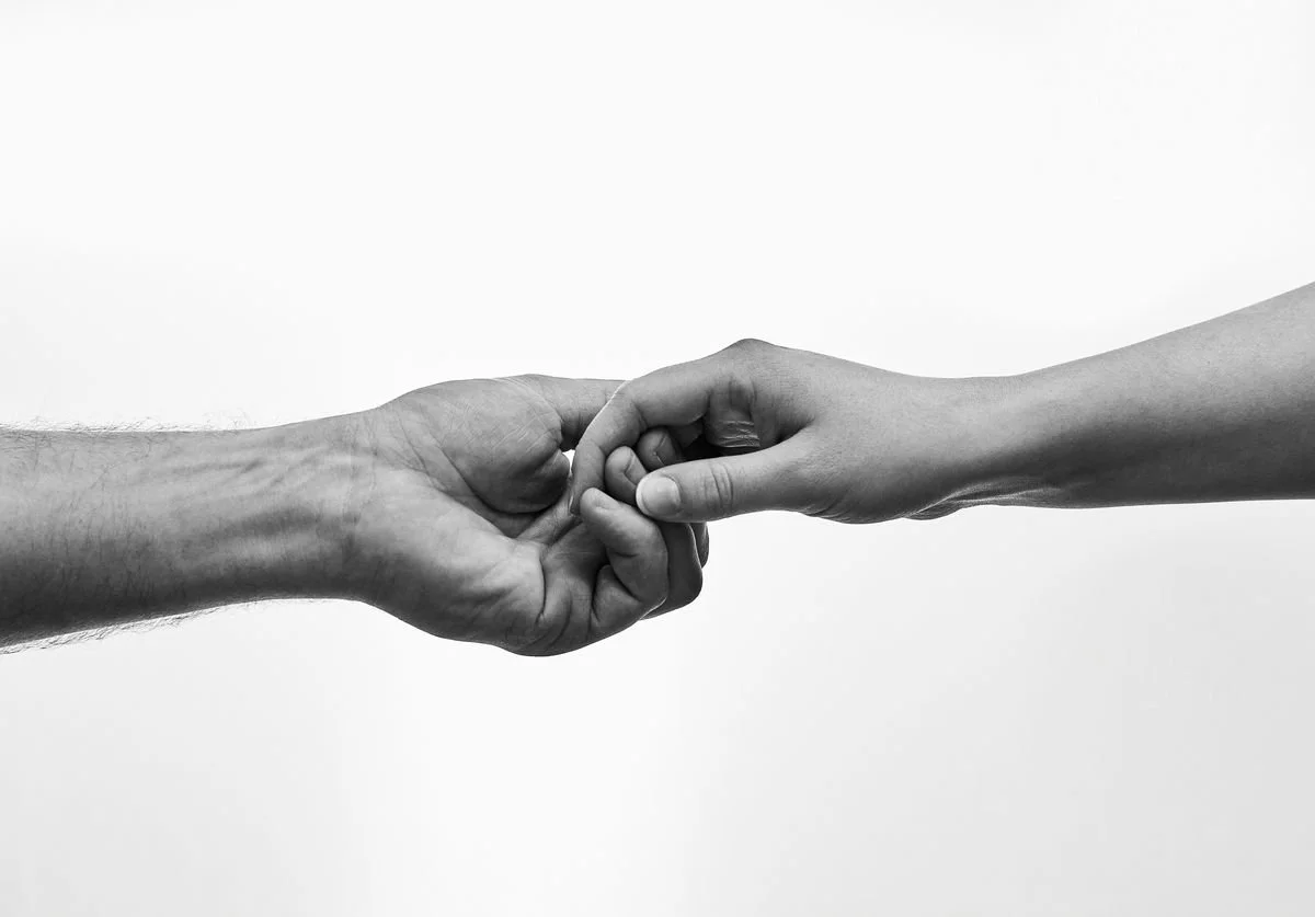 black-and-white-photo-of-man-and-woman-holding-hands.jpg