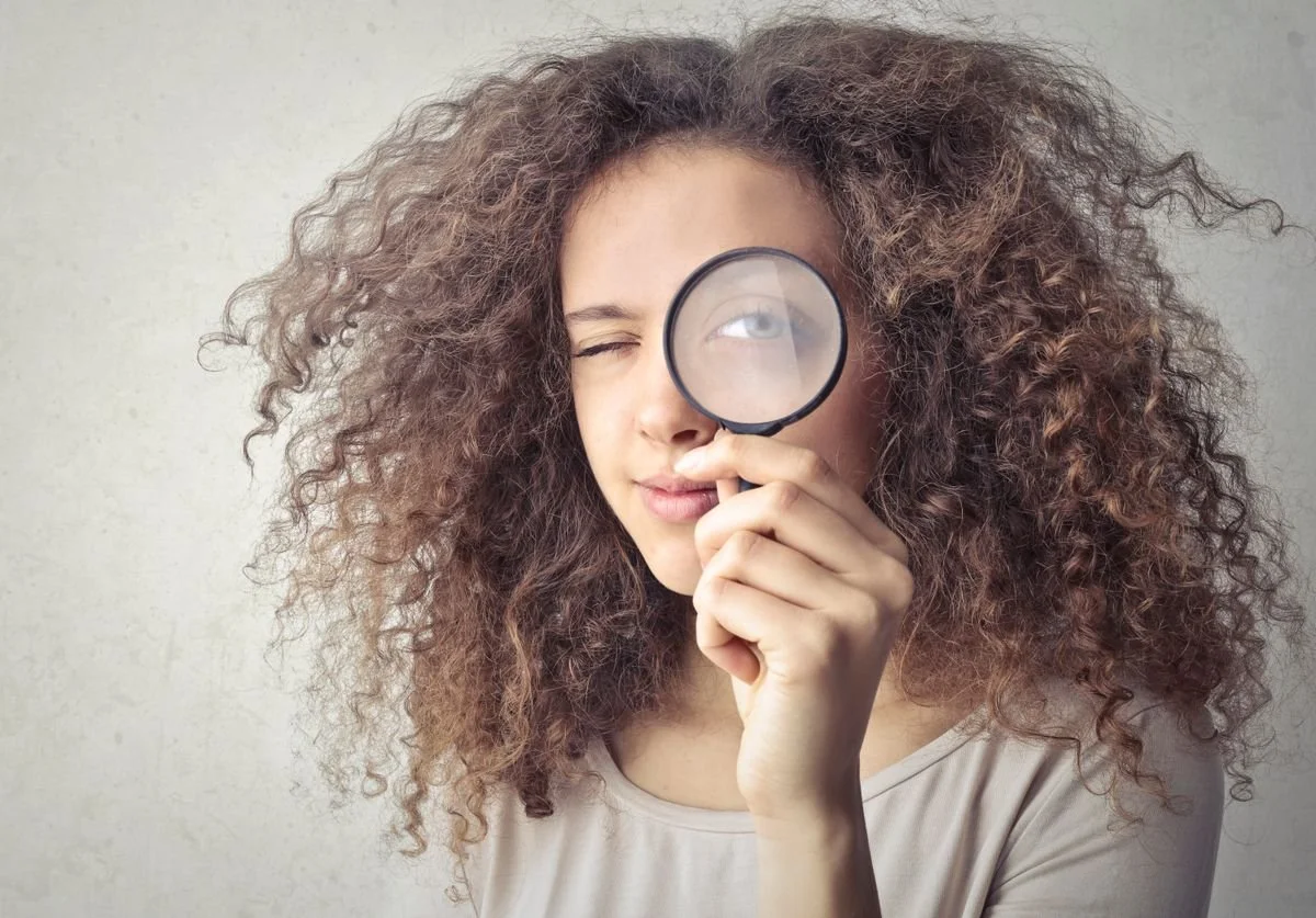 woman-looking-through-magnifying-glass.jpg