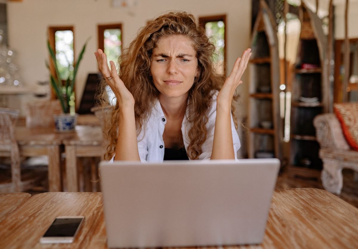 frustrated-woman-throws-up-her-hands-at-DIY-wellness-website-that-she-created.jpg