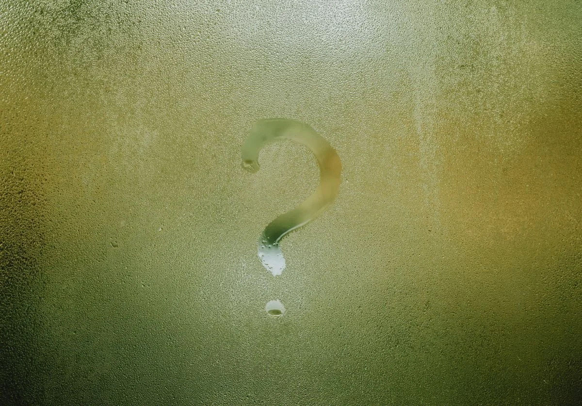 a-window-with-a-lot-of-condensation-on-it-and-a-question-mark-drawn-out-on-it-with-a-finger.jpg
