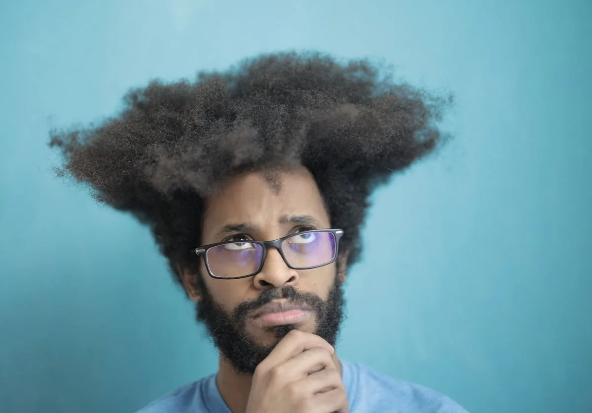 a-guy-thinking-with-cool-hair.jpg