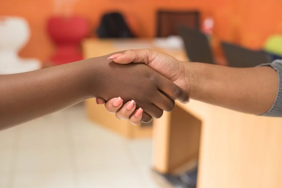 two-women-shaking-hands.jpg