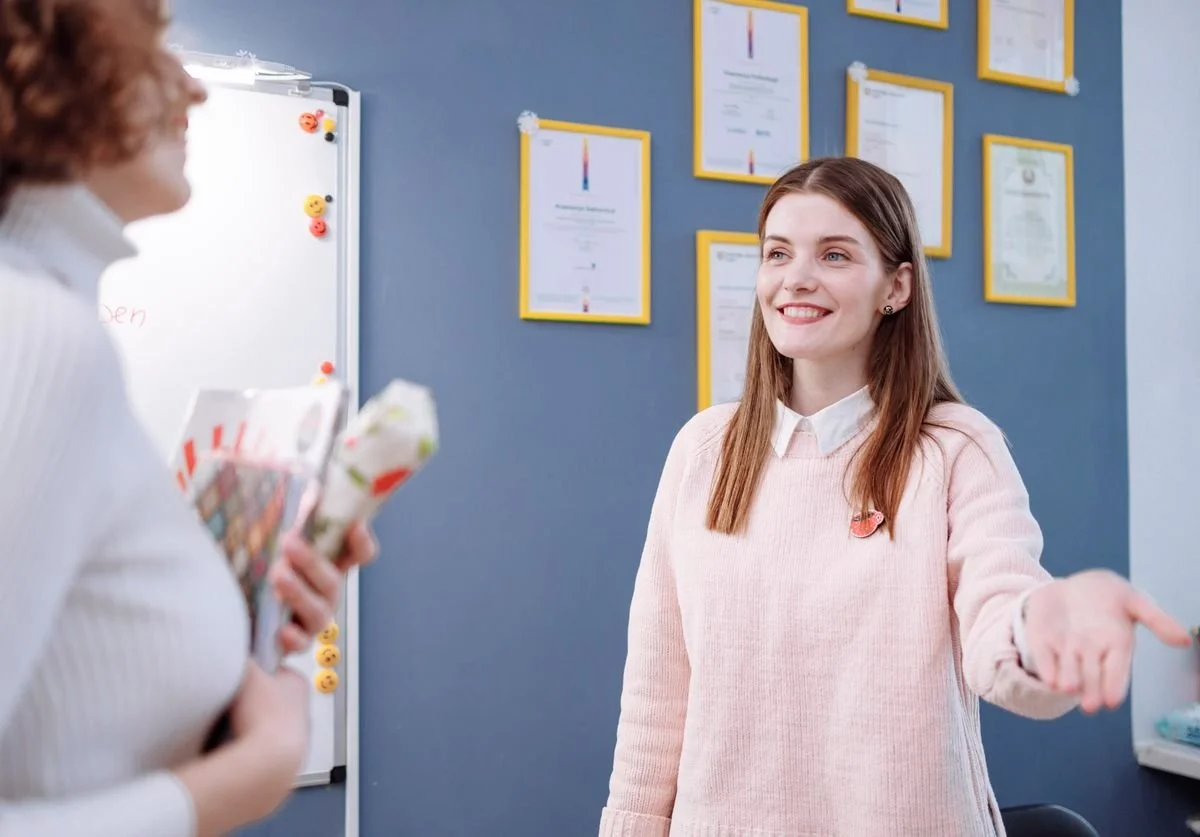 woman-explaining-something-to-another-woman-wellness.jpg