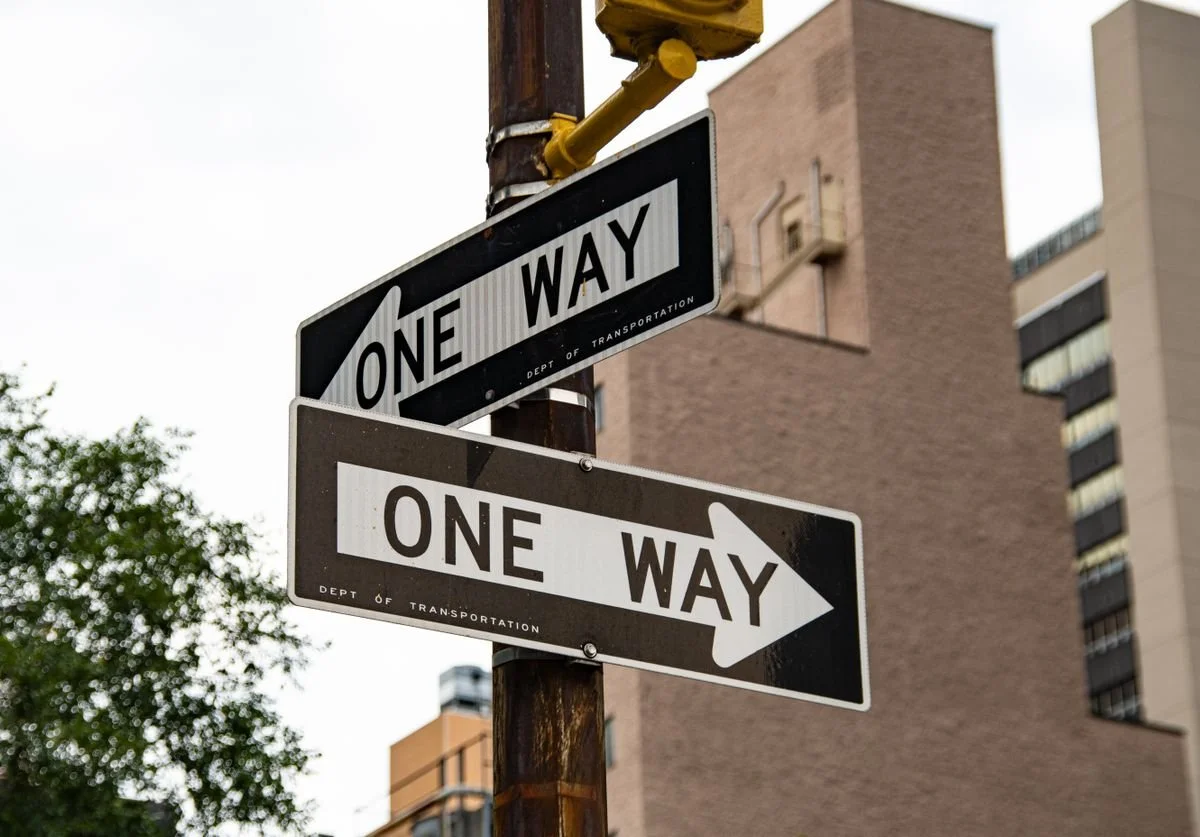 two-one-way-signs-pointing-in-different-directions-nomadic-virtual-solutions.jpg