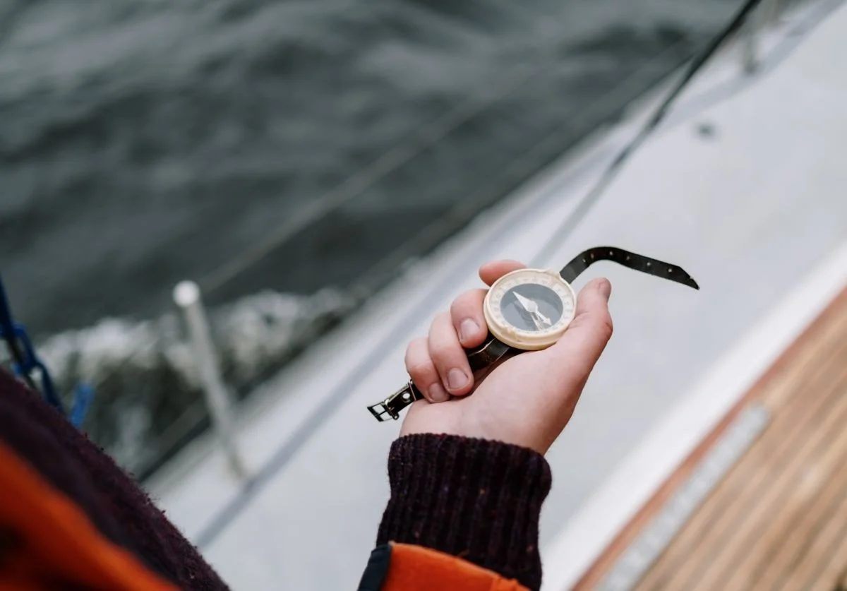 a-woman-holding-a-compass-seeking-directions.jpg