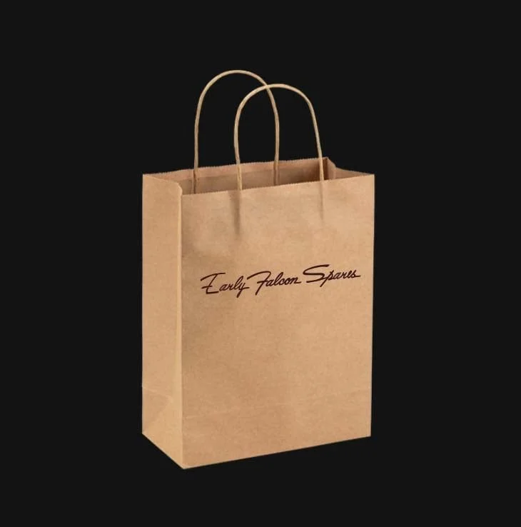 A brown paper shopping bag with handles and the words "Early Falcon Sports" written in cursive on the front, set against a black background.