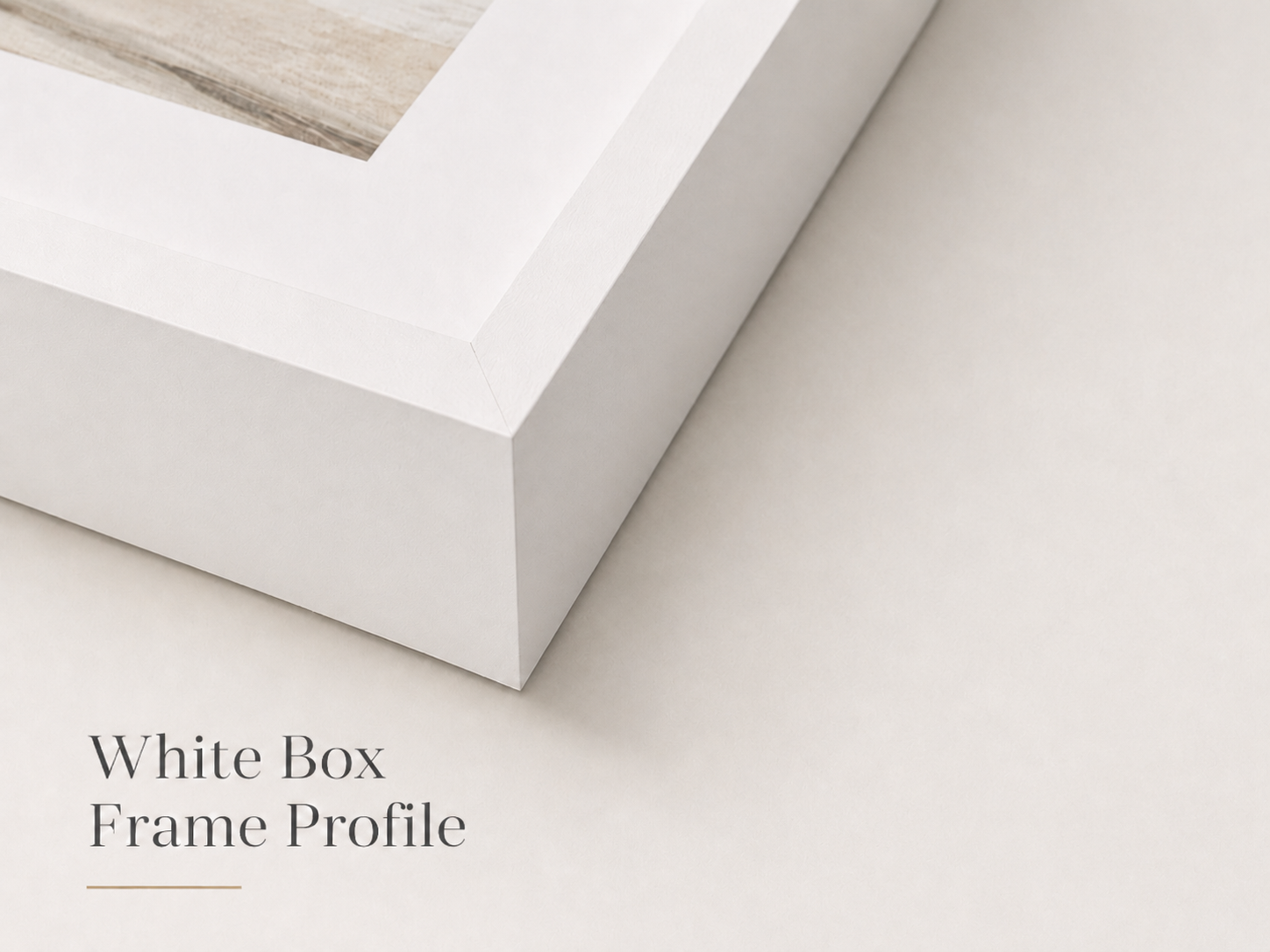 Close-up of a white picture frame with a rectangular clip on top, placed on a cream-colored surface, with text that reads 'White Box Frame Profile' in the bottom left corner.