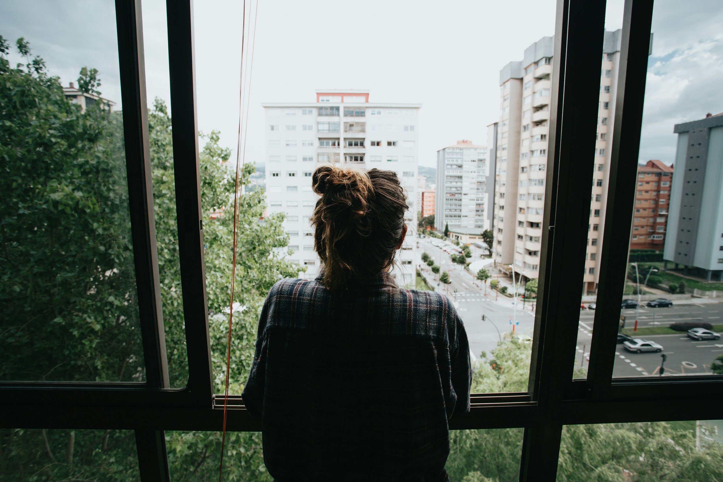 sad student looking outside window