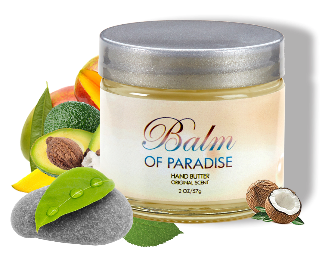 A jar of Balm of Paradise hand butter surrounded by tropical fruits, coconut, avocado, mango, and leaves on a black background.