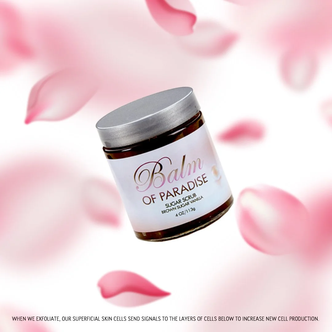 A jar labeled 'Balms of Paradise' with pink rose petals around it, on a white background. The label indicates it is a sugar scrub with brown sugar and vanilla.