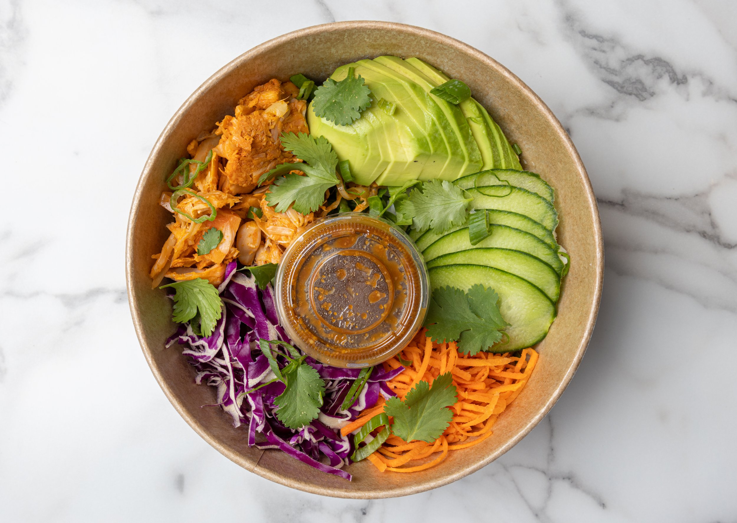 A colourful Get Fresh bowl with avocado, cucumber, rice and vegetables.