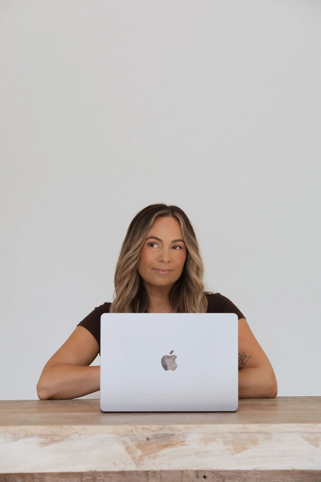Sonia Bavistock sitting in front of an open laptop