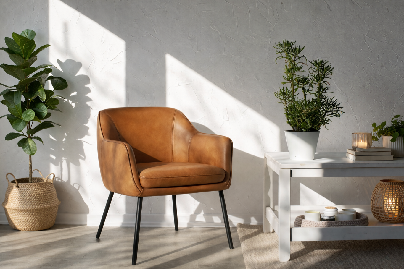 Cozy living room corner with a brown leather armchair, houseplants on a white table and in a woven basket, sunlight casting shadows on white textured wall.