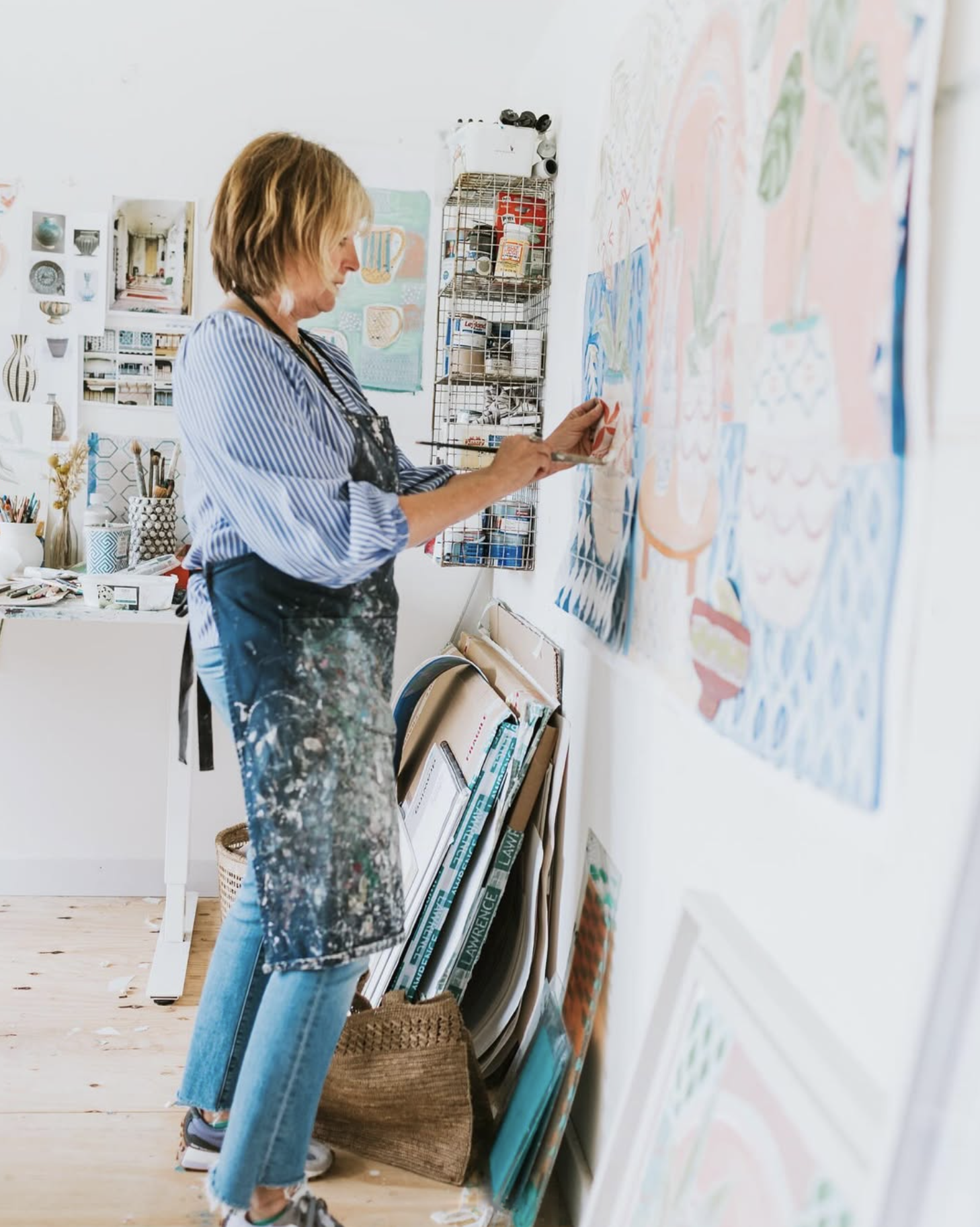 Portrait of artist Anrea Curtis in her studio