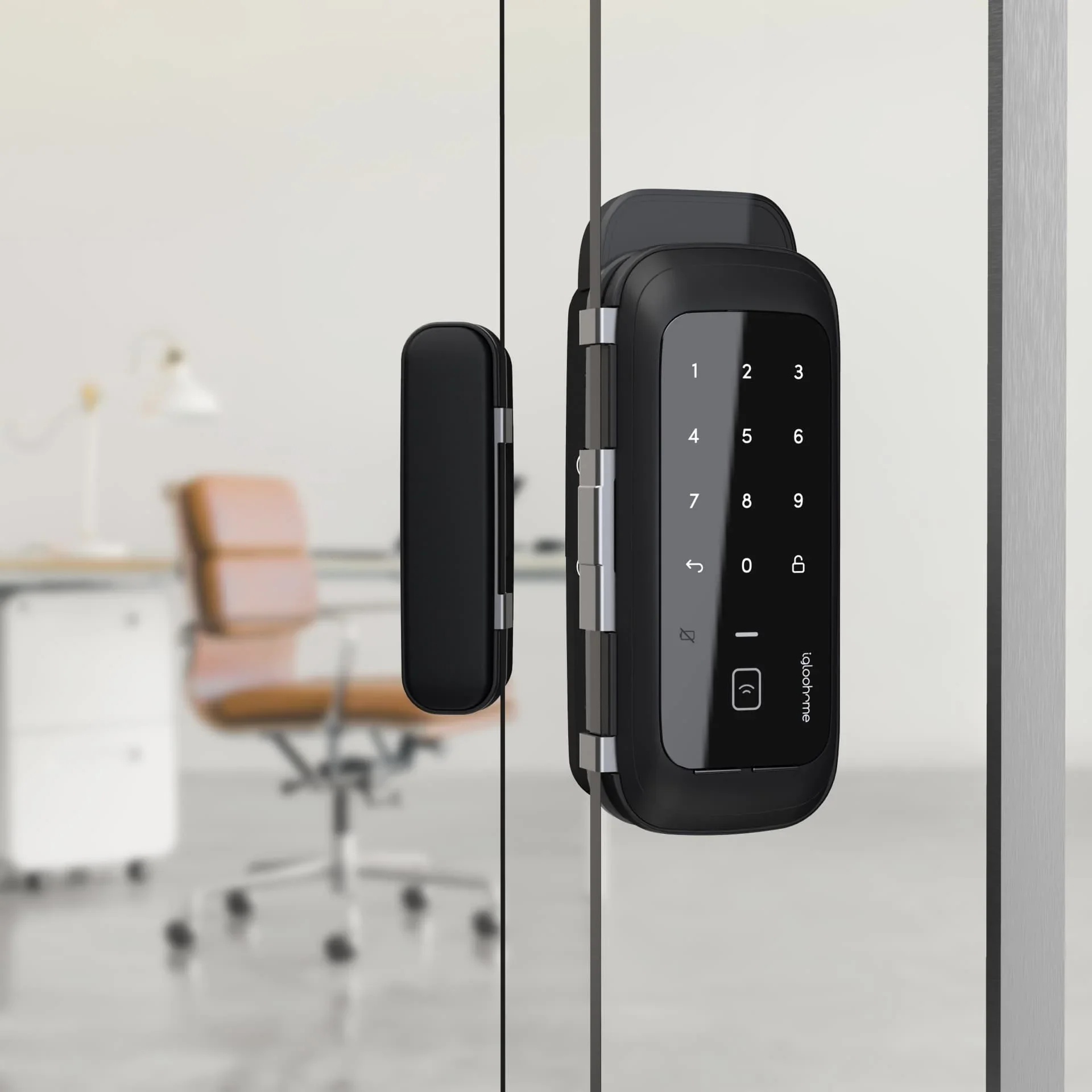 An image showing a keypad lock and a key card holder on a white wall, with a blurred office chair in the background.