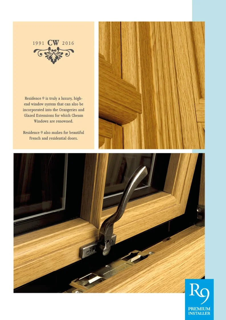 Close-up of a wooden window frame with a locking mechanism and grey handle, with part of a promotional pamphlet about residence window systems shown beside it.