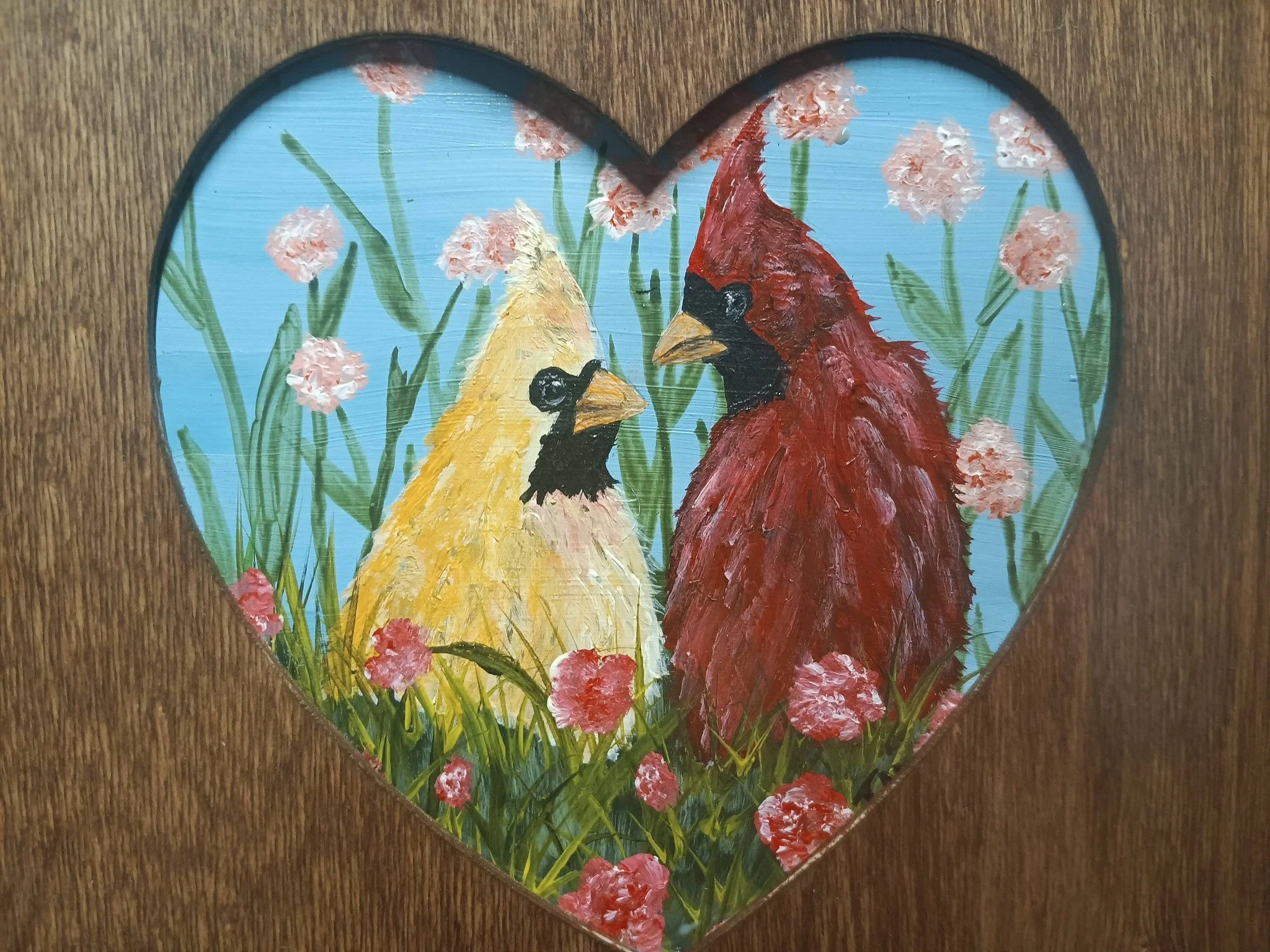 Red Cardinals in wooden heart frame.jpg