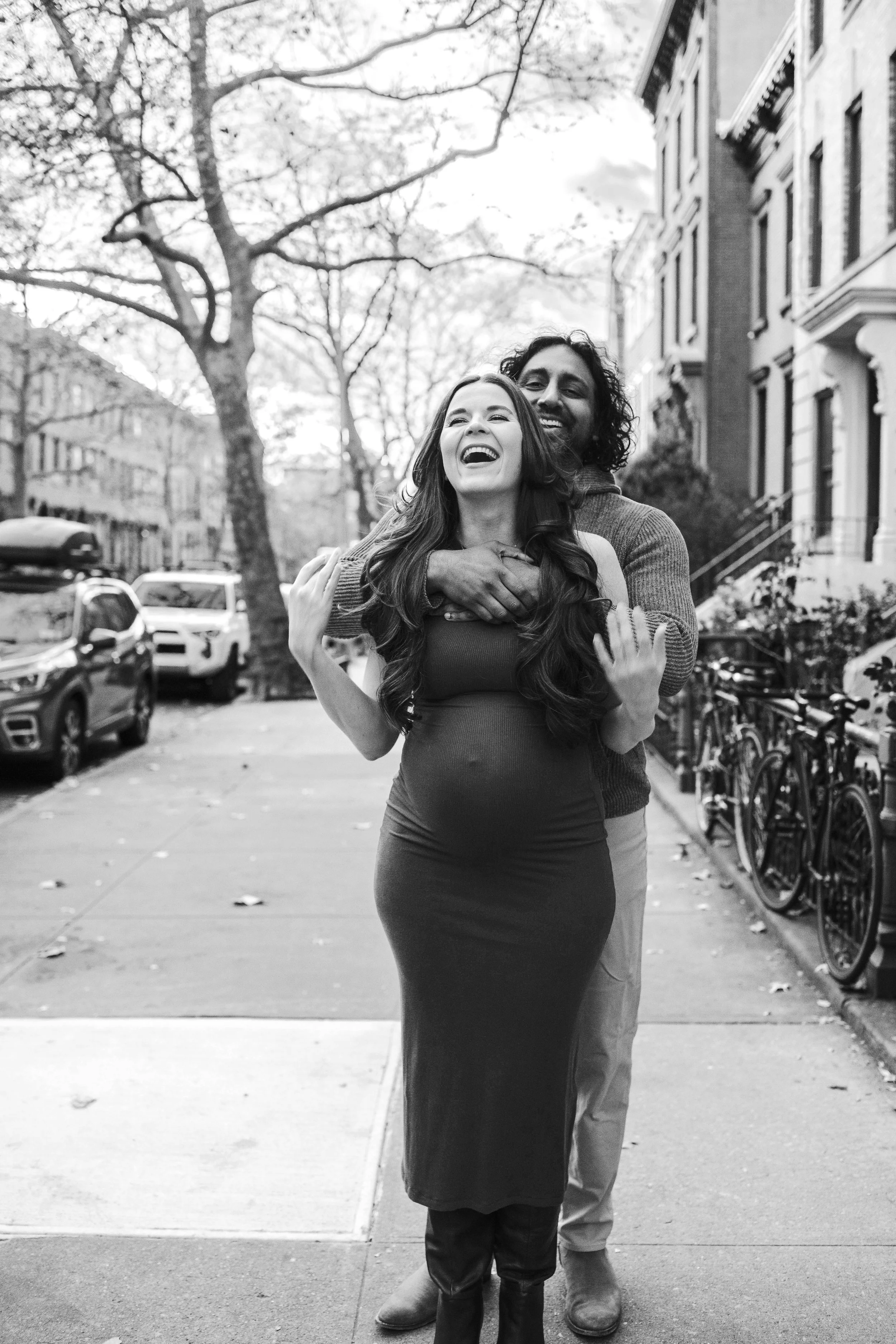 Maternity photo of a couple on a Brooklyn street during a pregnancy photo session