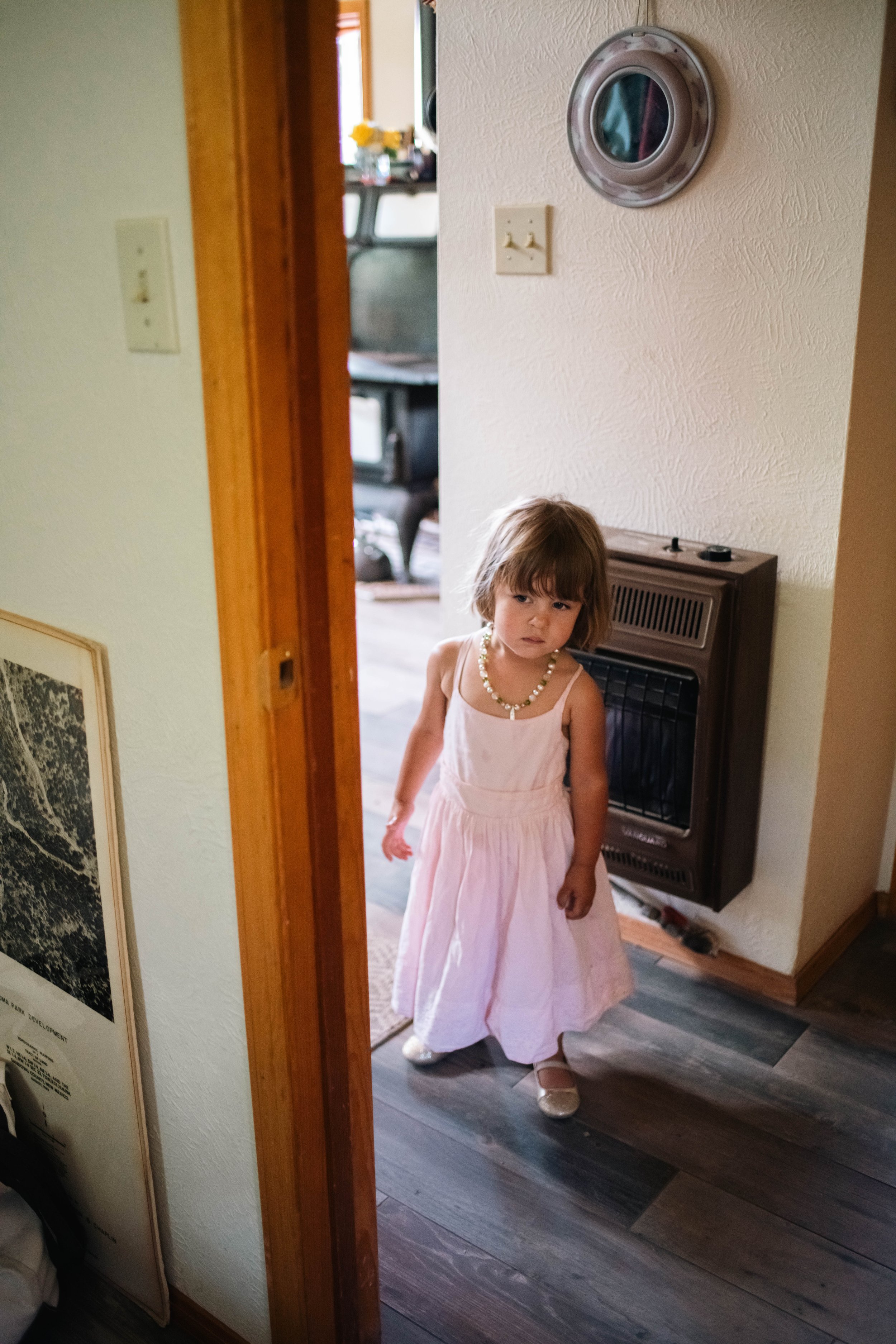 Flower girl watching the wedding ceremony at an Albuquerque New Mexico wedding