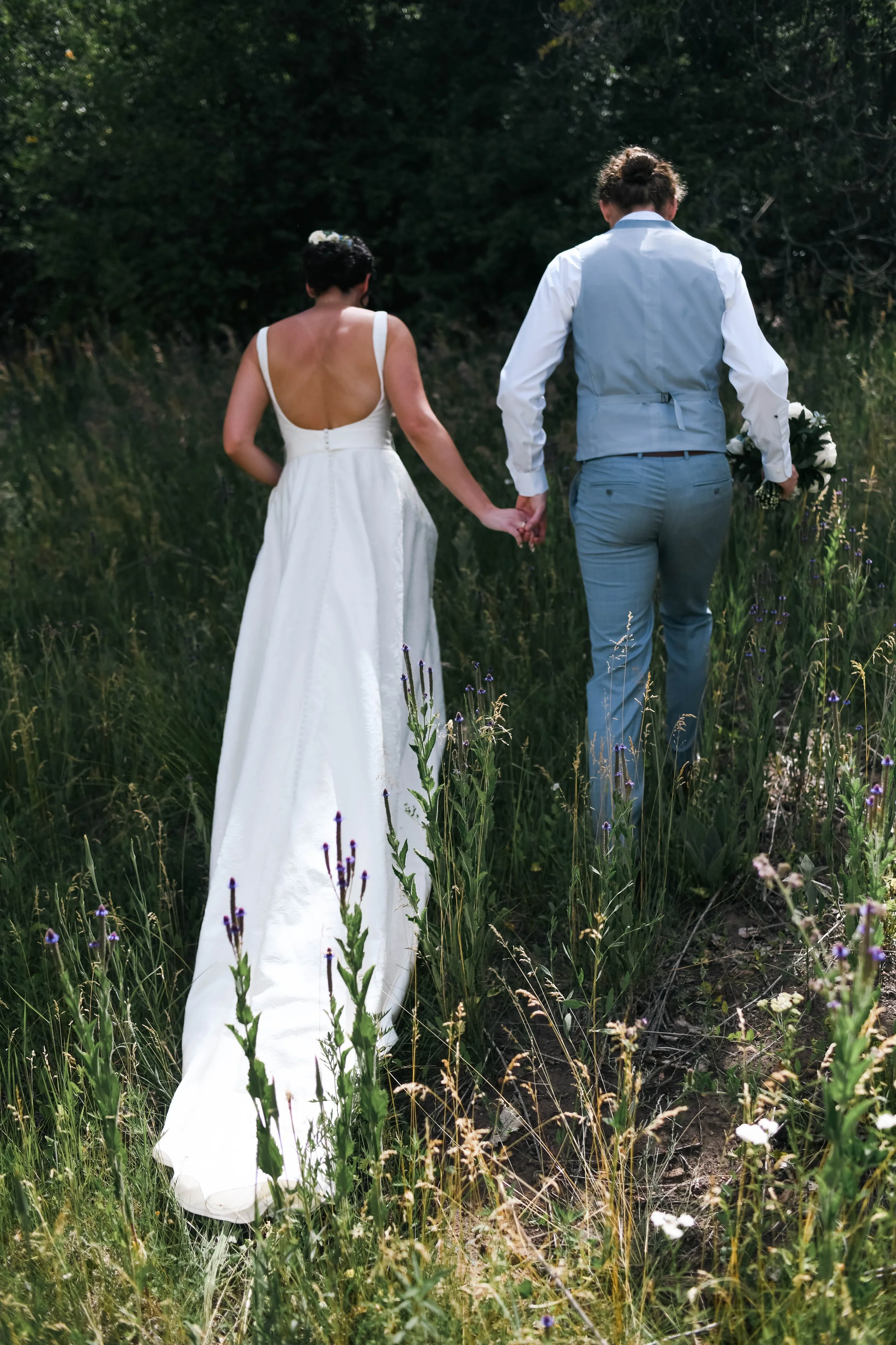 Bride and groom walking together during their outdoor wedding in Albuquerque New Mexico