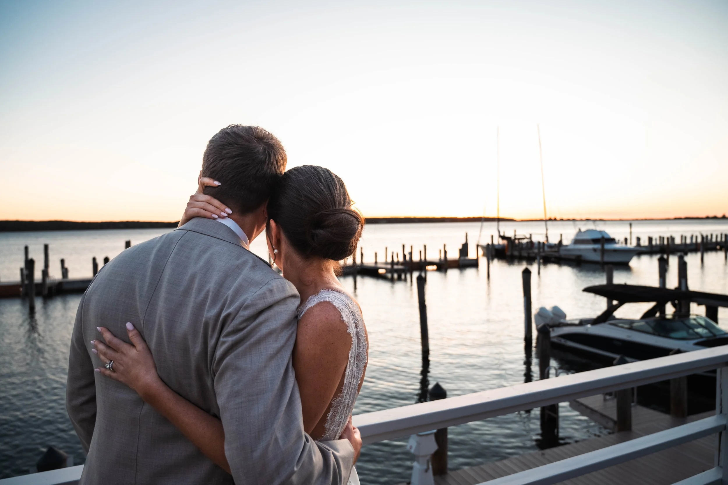 Sunset in East Hampton wedding bride and groom embrace outside