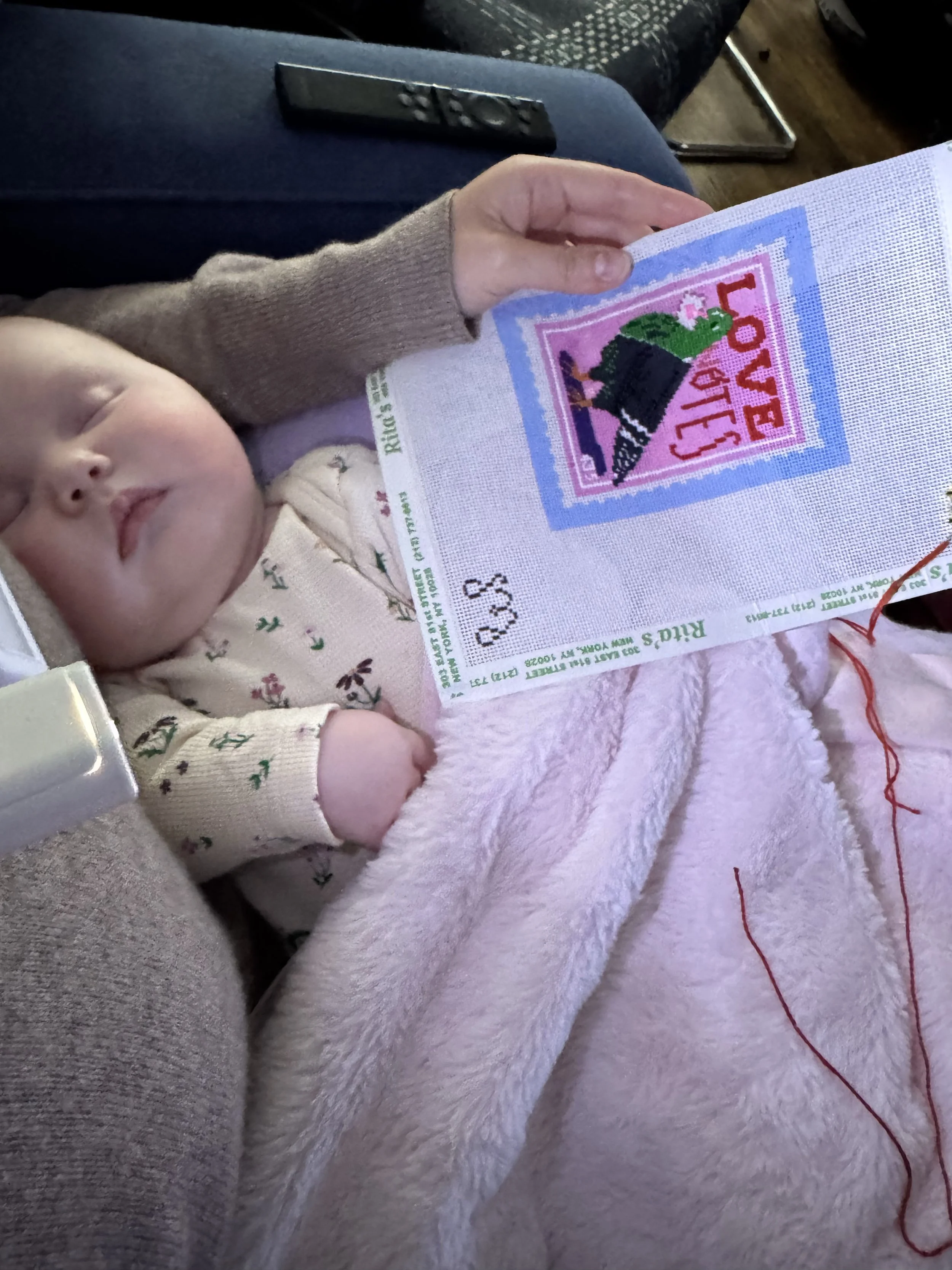 needlepointing with baby.jpg
