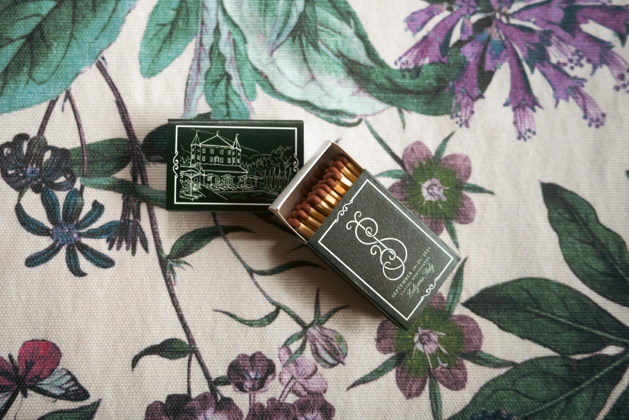  Custom personalized matchboxes placed as party favors for a destination wedding celebration in Bolzano, Italy. 