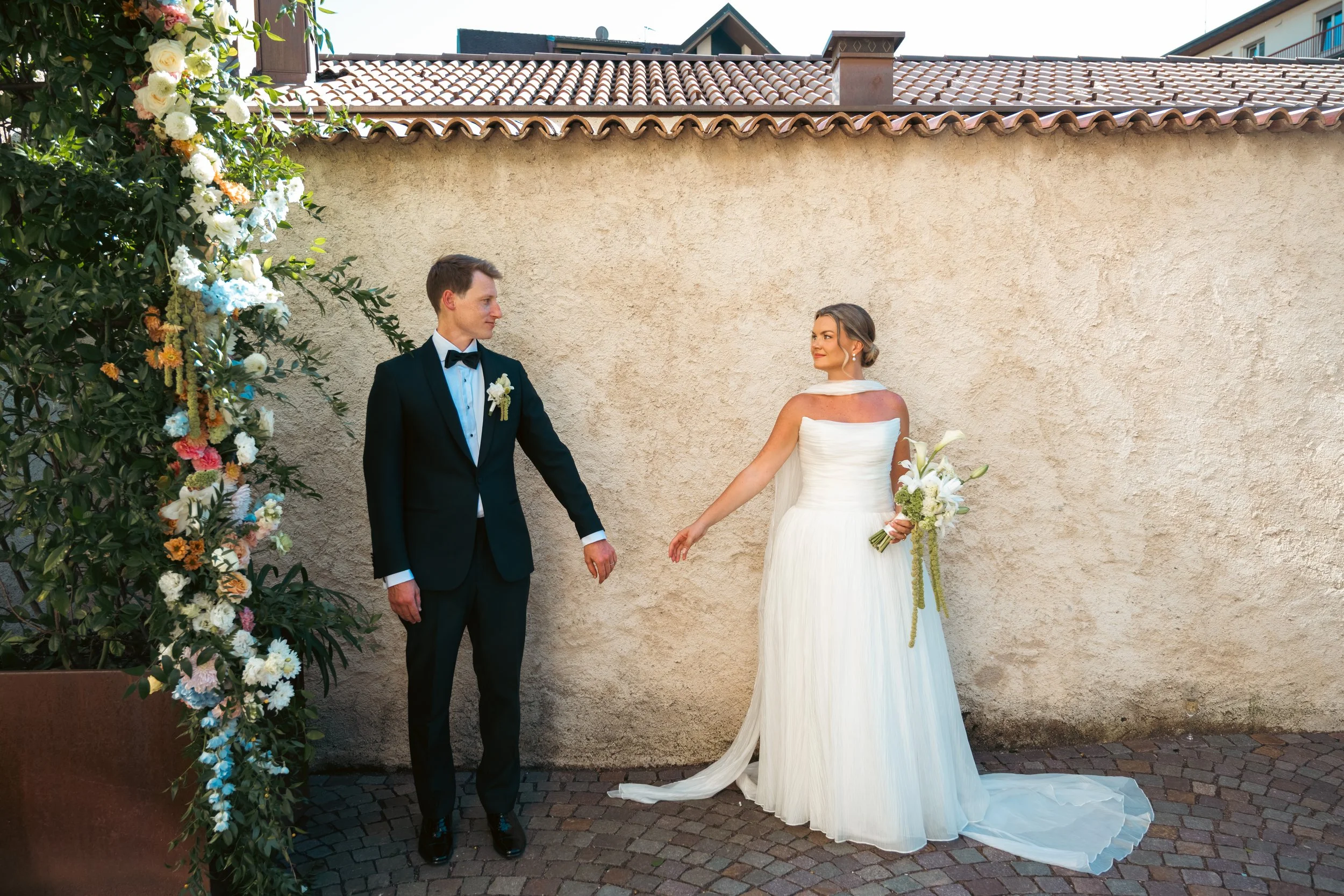  Editorial-style bride and groom portrait captured on the grounds of Castel Hörtenberg. 