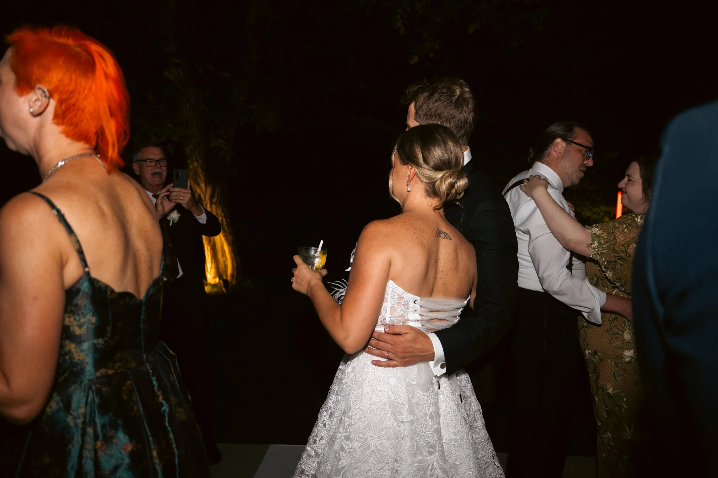  Wedding guests celebrating and dancing on the dance floor during the evening party. 