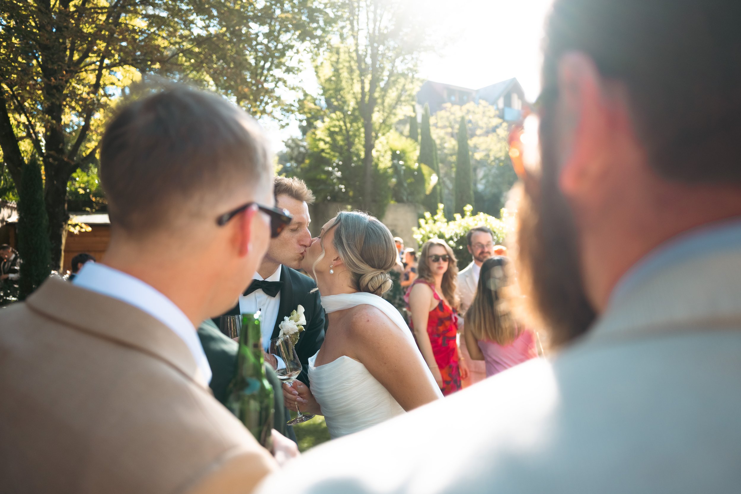 bride-groom-kissing-cocktail-hour-castel-hortenberg.jpg