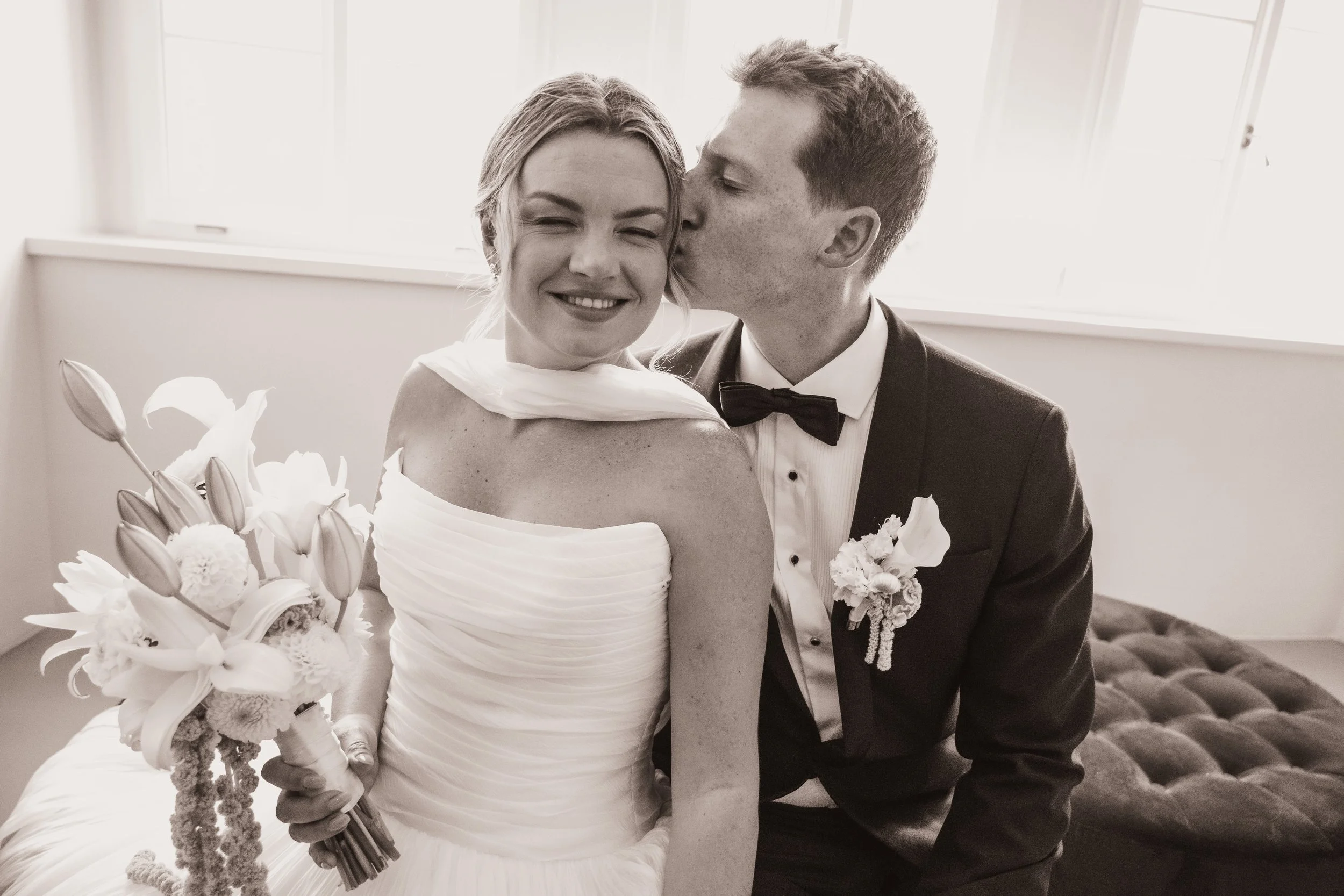  Romantic embrace between bride and groom during their destination wedding in Bolzano. 