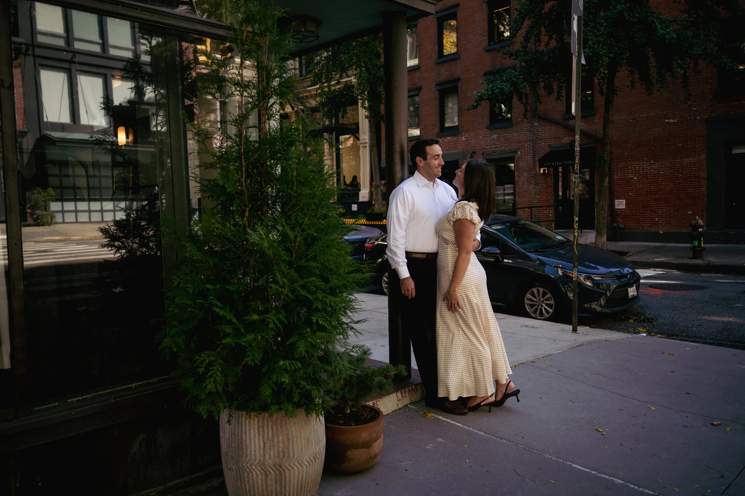 engaged couple looking at eachother during tribeca engagement photoshoot.jpg