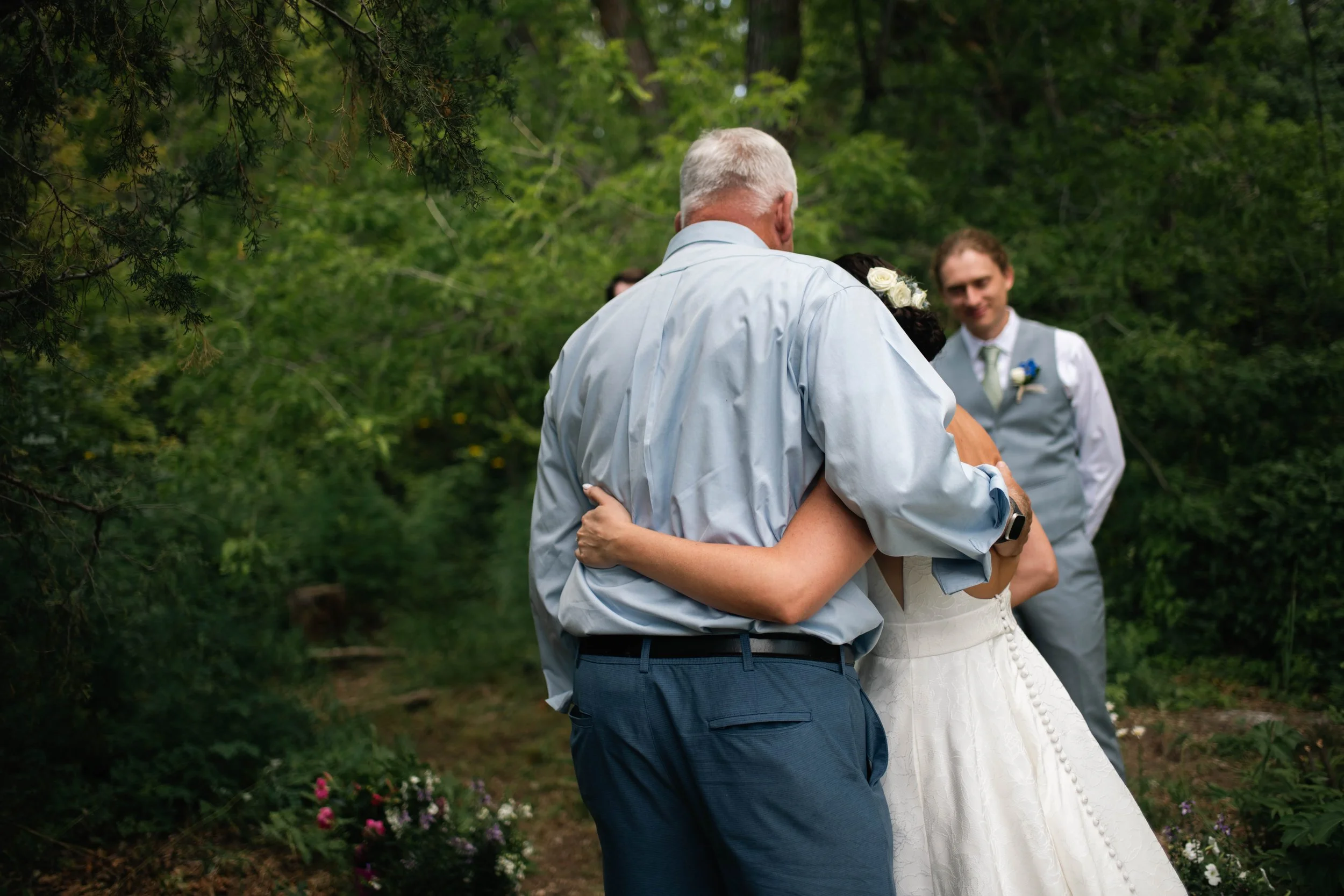 Father and daughter sharing a hug as he walks her down the aisle at an Albuquerque New Mexico wedding