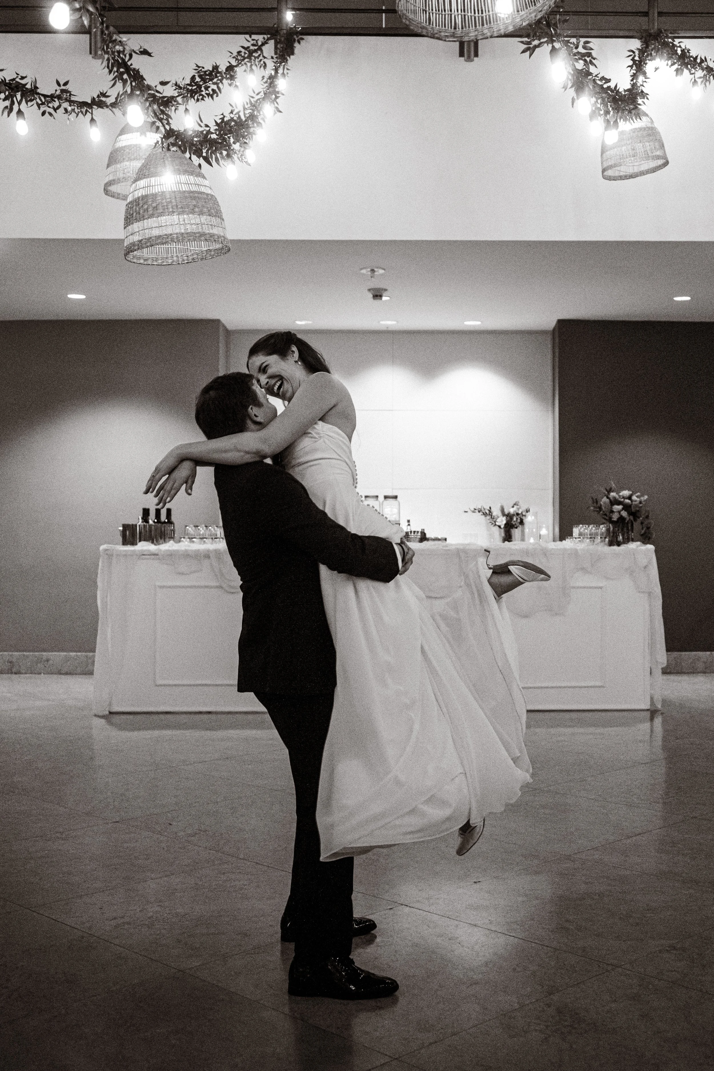 groom-lifting-bride-black-and-white-mapr-san-juan-puerto-rico-wedding.jpg
