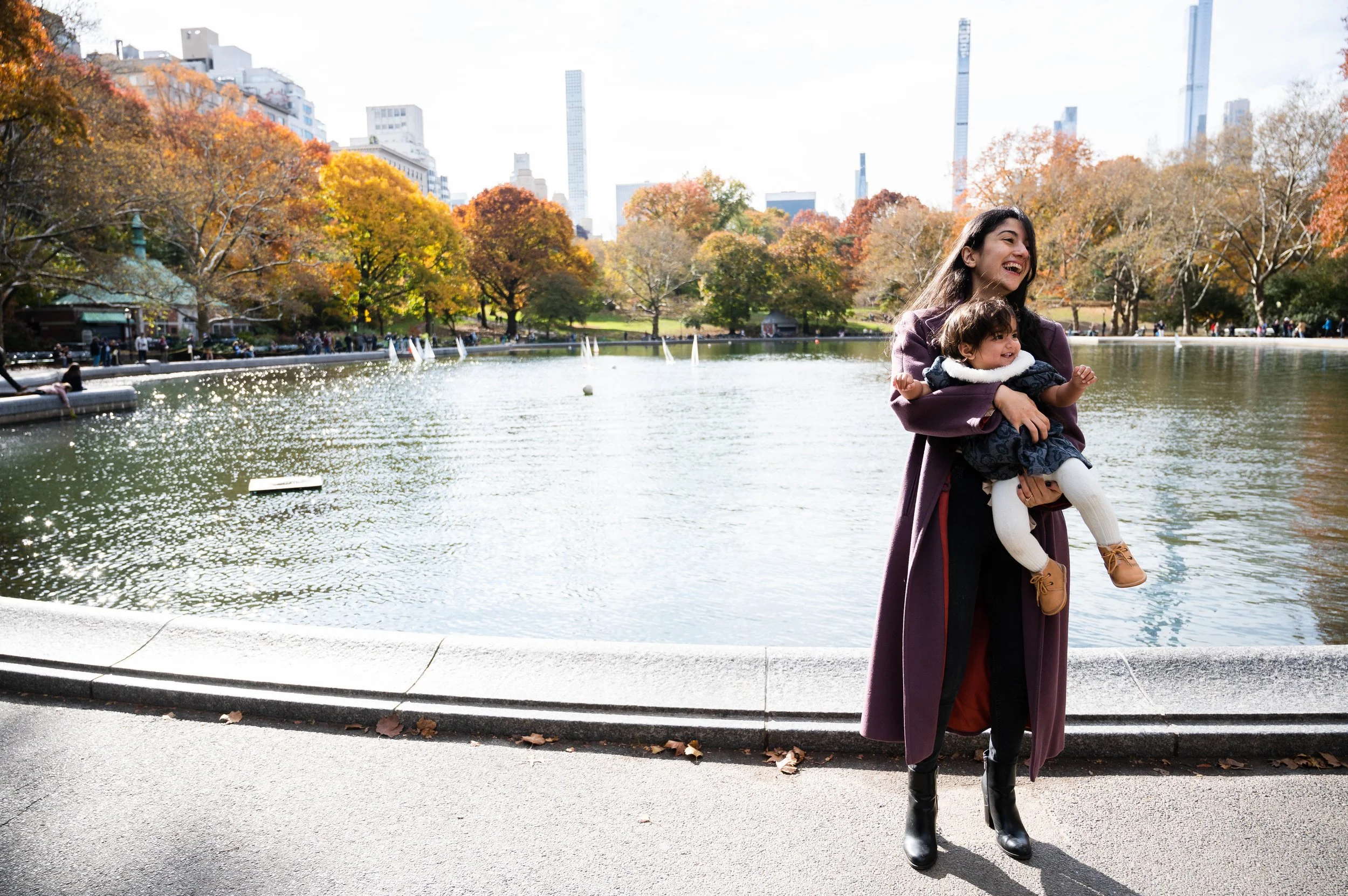Mother holding her daughter during a family portrait session in Central Park New York City