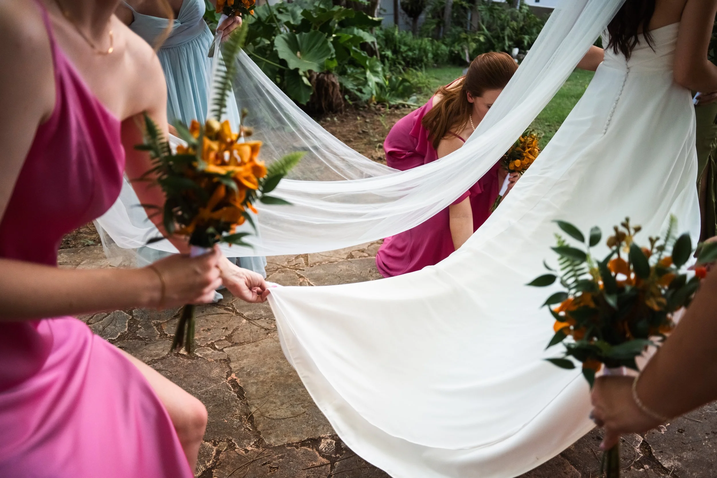 bridesmaids-carrying-bridal-veil-garden-mapr-san-juan-puerto-rico-wedding.jpg